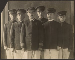 Group of Young Men in Uniform Before Tapestry by Louis Fleckenstein