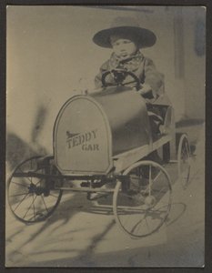 Little Boy Seated in Teddy Car