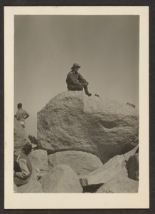 [Man Seated on Rocks] by Louis Fleckenstein