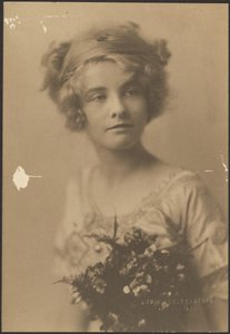 Portrait of a Woman Holding Bouquet with Fern