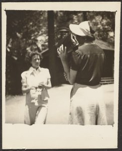 Woman Holding Purse by Face by Louis Fleckenstein