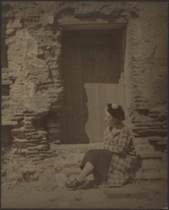 Woman Seated Before Deteriorating Building by Louis Fleckenstein