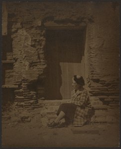 Woman Seated Before Deteriorating Building by Louis Fleckenstein