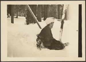 Woman Sitting in Snow