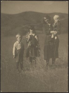 Woman and Three Children in Field by Louis Fleckenstein