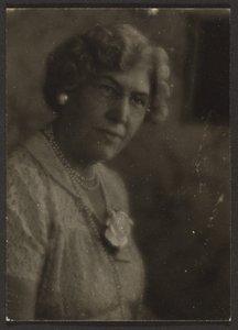 Woman with White Flower and Pearls