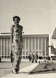 Model wears a long dress with a floral pattern, created by the couture house Graldi by Luis Bogino