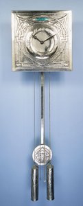 A wall clock by Margaret Gilmour, decorated in repousse with Celtic entrelac designs by Margaret Gilmour