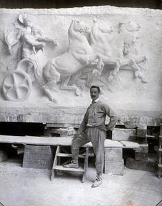 Full-Length Portrait of the Famous Sculptor Pietro Canonica. He is Posing in His Studio Before a Marble High Relief He is Working On (b/w photo)