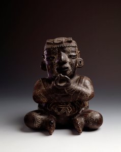Anthropomorphic clay vase depicting a man seated with hands joined in the shape of a circle by Mayan Mayan