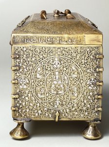 A Mesopotamian silver inlaid brass casket with dials for a combination lock (side view)