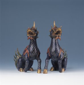 A pair of seated qilin by Ming Dynasty   Wanli Period Chinese School