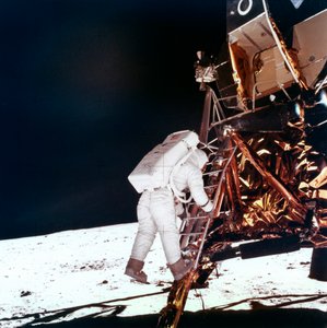 Edwin Buzz Aldrin descends the steps of the Lunar Module ladder to walk on the Moon by NASA Images