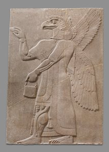 Relief panel of winged eagle-headed supernatural figure by Neo Assyrian