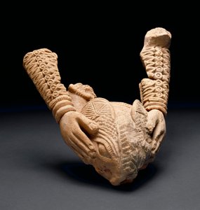 Arms holding animal head, Owo
