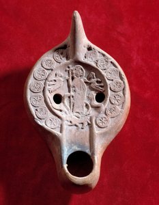 Paleochristian art: oil lamp medallion with a triumphant Christ by Paleo Christian