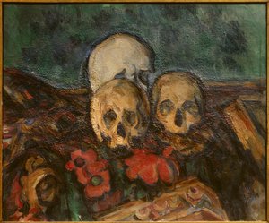 Three skulls on an oriental rug