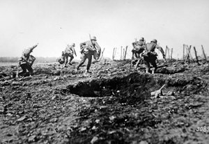 WWI German stormtroopers advance at Sedan with bags of grenades slung round their necks, Western Front by Photographer German