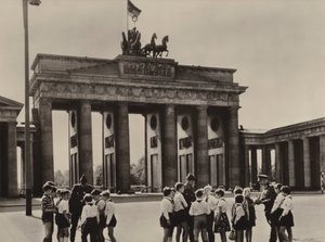 Young pioneers come to the Brandenburg Gate, the landmark of Berlin, to see their friends, the frontier guards by Photographer German