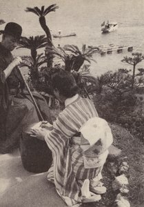 Japanese businessman and his secretary taking shorthand notes by Photographer Japanese