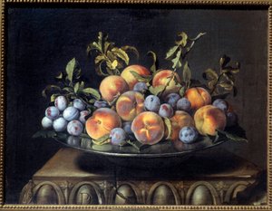 Peaches and plums in a tin dish