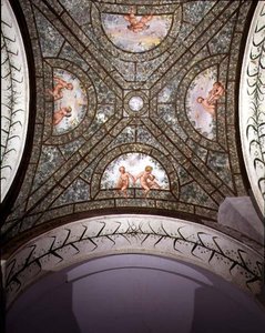 The semicircular ionic portico, detail of the ceiling vault decorated with putti in a garden