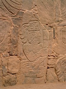 Figure of a warrior wearing a helmet and holding a club by Pre Columbian Pre Columbian