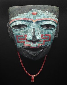 Funeral mask covered by turquoise and red shell mosaic. Artifact from Teotihuacan, Mexico City. Teotihuacan Civilization - Precolombian art: funeral mask of turquoise and pink stones dating from the civilization of Teotihuacan III (300-650 AD) by Pre Columbian Pre Columbian