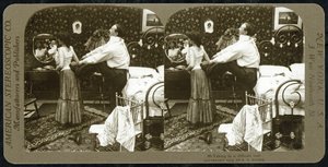 Stereoscopic card depicting a woman being laced into a corset by R.Y Young
