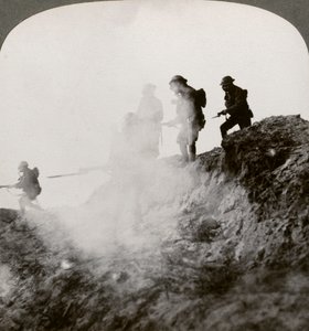 British soldiers advancing under cover of gas and smoke, France, World War I