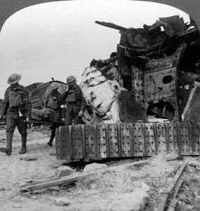 Casualties from the front pass destroyed tanks, Villers-Bretonneux, France, World War I