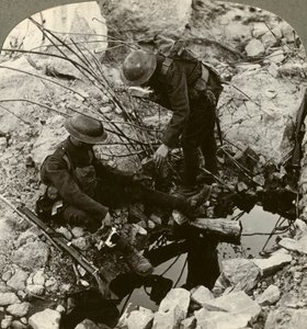 Giving water to a wounded pal, Hooge, Ypres, Belgium, World War I, 1914-1918