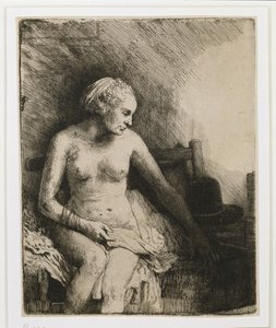 A woman at the bath with a hat beside her by Rembrandt van Rijn