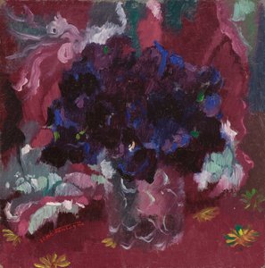 Blue pansies in a glass