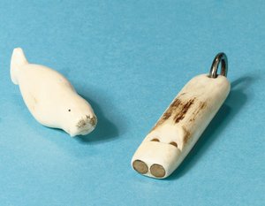 Model of a walrus and a whistle