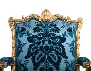 One of a pair of George III giltwood armchairs