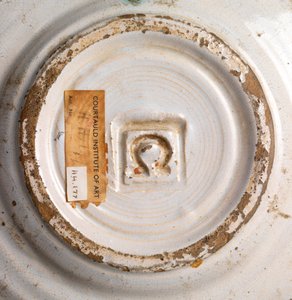 White tin-glazed side plate