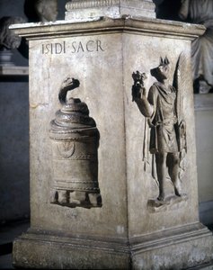 Altar dedicated to Isis. Left: mystic stone with snake and right: Anubis-Hermès. The words 