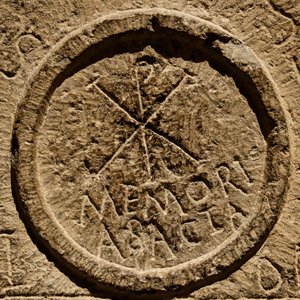 Detail from an altar stone depicting an abbreviation for the name of Jesus Christ by Roman
