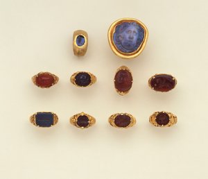 A Roman Gold and Chalcedony Intaglio Ring, a Large Roman Blue-Grey Chalcedony Medusa Head Cameo and a Selection of Rings, Two Rings in the Seljuk Style by Roman Roman