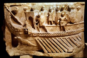Low Roman relief depicting a bireme. A crocodile can be seen below the bow. Vatican, Vatican City, monuments, museums and pontifical galleries. by Roman Roman