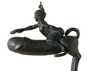 Sasamon Phallus. 1st c. Animal with Chest, Legs and Tail Shaped Glans, Mounted by a Woman with Laurel Wreath. Amulet Against the Evil Eye. Roman Art. Early Empire. Sculpture on Bronze. Spain. Catalonia. Barcelona. Archaeology Museum of Catalonia