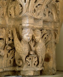 Top decorates sirens and birds on the model of those of the Church Saint Loup de Naud