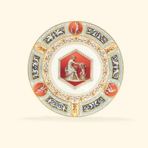 A porcelain dinner plate from the Raphael Service, the centre depicting a classicising lady and a putto, 1903