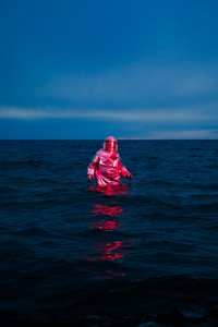 Red Suit Blue Sea by Samantha Hearn
