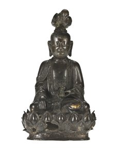 Figure of Guanyin, the Chinese goddess of mercy seated on a lotus design base with a raven perched on her head and a rabbit resting in her left hand