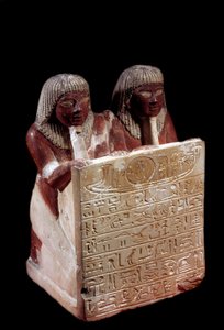 Egyptian antiquity: limestone statue that acts as stele in the name of Didi and his son Padoua. New Empire. From Deir el Medineh. Paris, Musee du Louvre