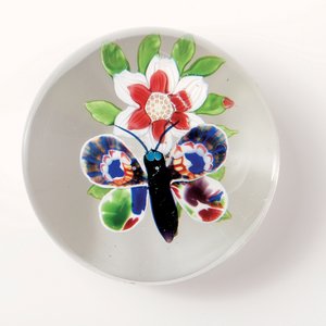 Baccarat butterfly and flower weight, the insect with deep purple body and antennae, multi-coloured wings