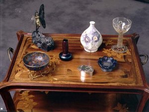 Loetz iridescent glass vase, a pate-de-verre bow by Argy Rousseau and a glass with moulded and etched decoration by Lalique