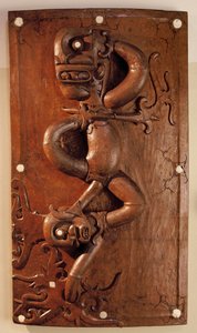 Carved door depicting the victory of the protective spirit over evil in Sarawak, Malaysia